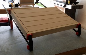 The shoe box lid, glued and clamped.  The five slats are free floating in grooves to allow for wood movement.